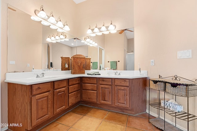 bathroom with vanity, a shower with shower door, and tile patterned floors