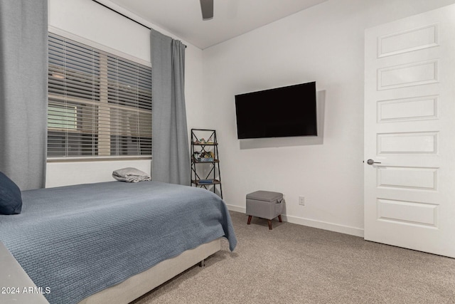 carpeted bedroom with ceiling fan