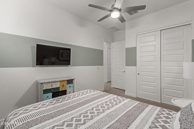 carpeted bedroom with a closet and ceiling fan