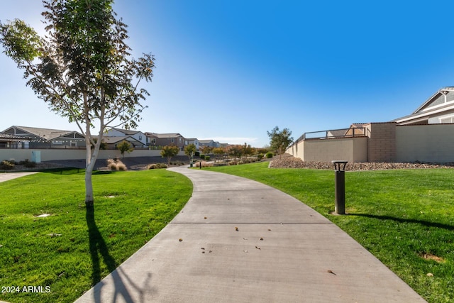 view of home's community with a lawn