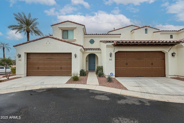 mediterranean / spanish-style house featuring a garage