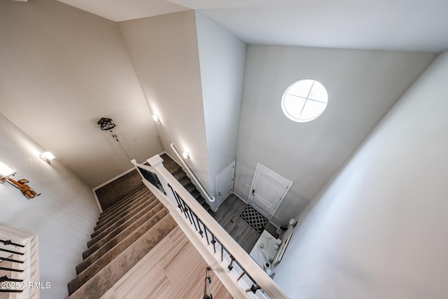 stairs featuring hardwood / wood-style flooring