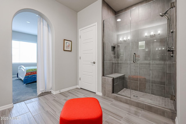 bathroom featuring a shower with shower door