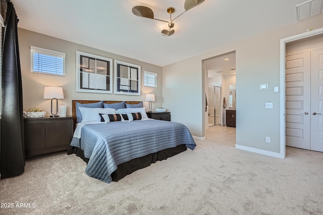 10136 E Ursula Ave, Mesa, AZ 85212 - carpeted bedroom featuring connected bathroom and baseboards