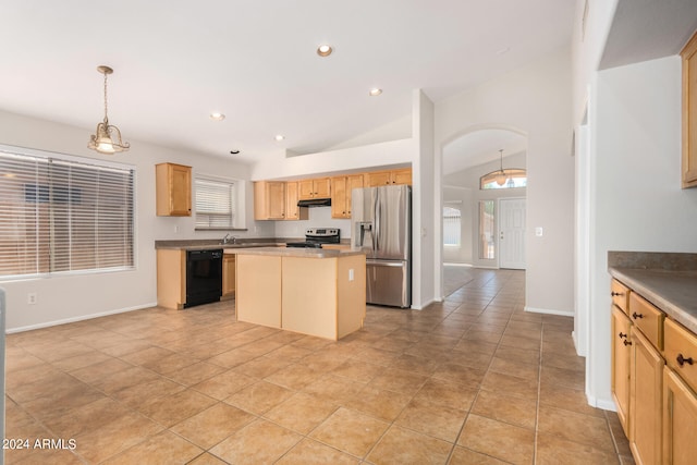 kitchen featuring appliances with stainless steel finishes, lofted ceiling, plenty of natural light, and a center island