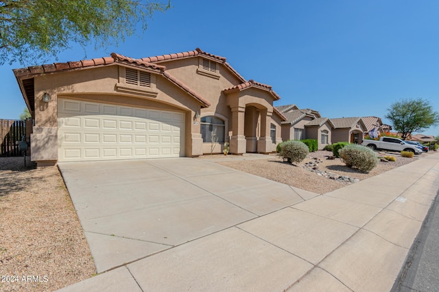 mediterranean / spanish-style house featuring a garage