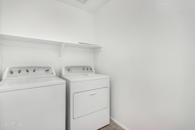 laundry room with independent washer and dryer