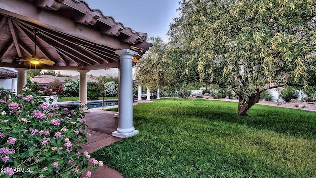 view of yard with ceiling fan