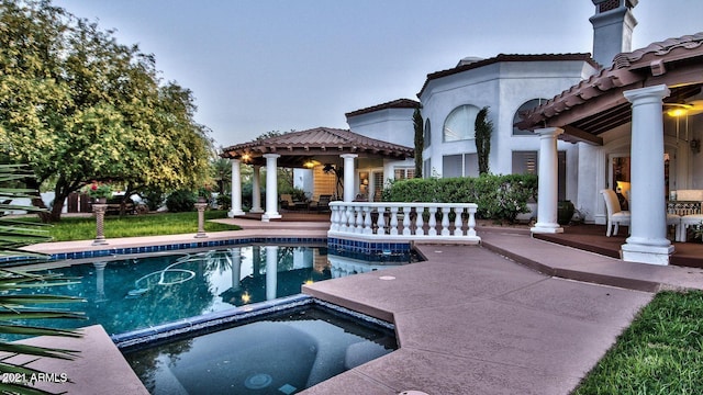 view of pool featuring an in ground hot tub, a gazebo, and a patio