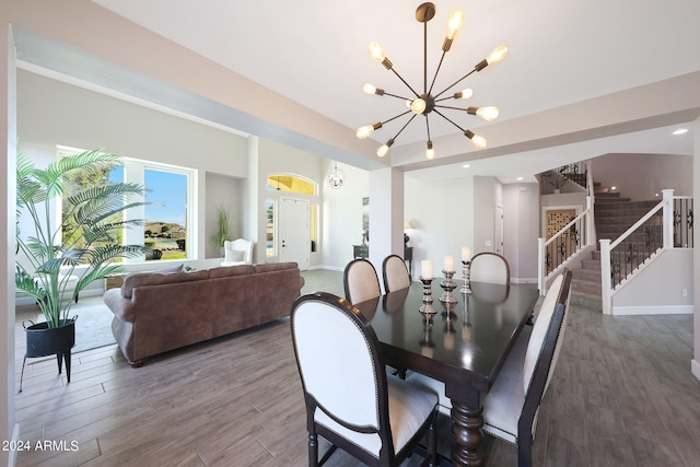 dining room featuring a notable chandelier and hardwood / wood-style flooring