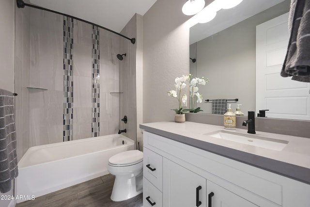 full bathroom featuring hardwood / wood-style flooring, vanity, toilet, and shower / bath combination with curtain