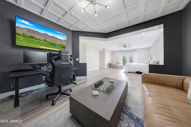 interior space featuring an inviting chandelier, coffered ceiling, and hardwood / wood-style floors