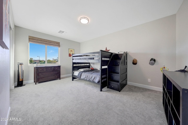 bedroom featuring light carpet