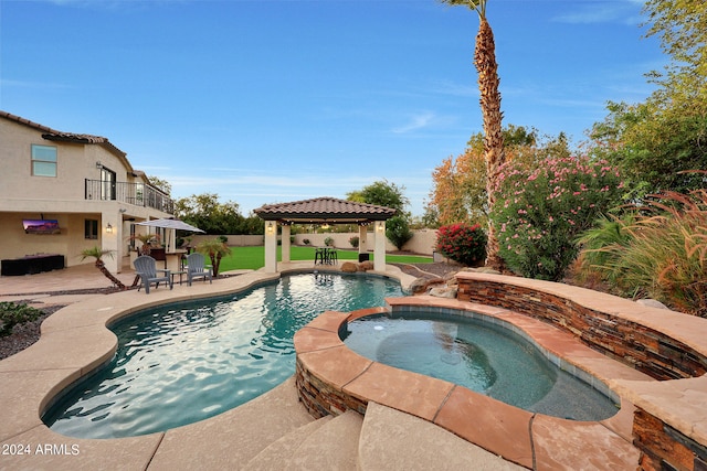 view of pool with a gazebo, an in ground hot tub, and a patio area