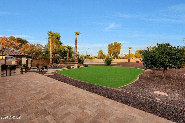 view of swimming pool featuring an in ground hot tub and a patio