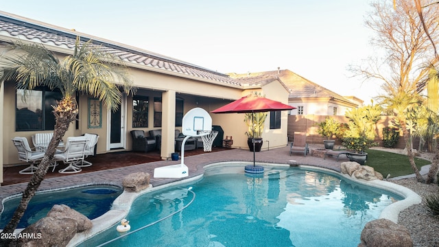 view of swimming pool with a patio