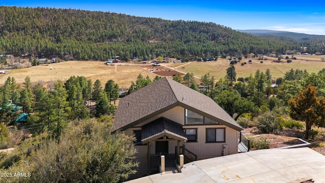 9661 W Coyote Dr, Strawberry, AZ 85544 - aerial view featuring a wooded view and a mountain view