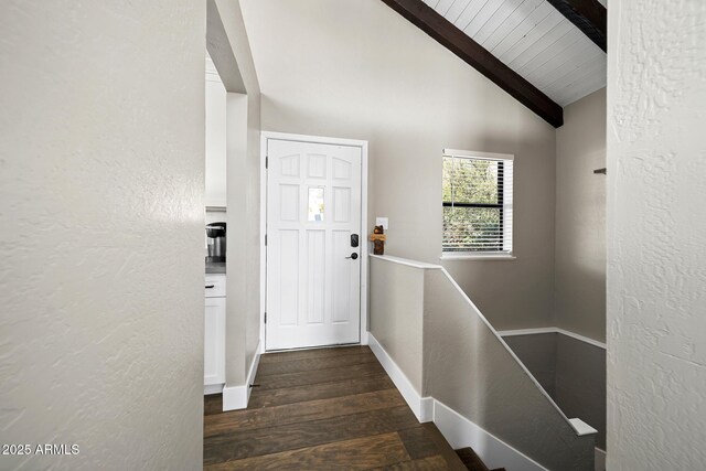 9661 W Coyote Dr, Strawberry, AZ 85544 - doorway featuring lofted ceiling with beams, a textured wall, baseboards, and dark wood finished floors