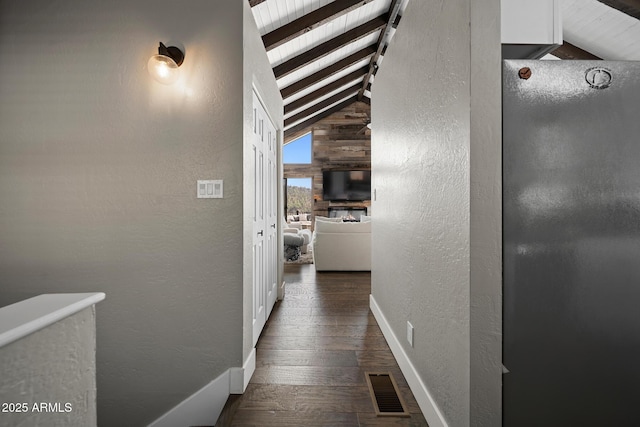9661 W Coyote Dr, Strawberry, AZ 85544 - corridor featuring visible vents, baseboards, wood finished floors, vaulted ceiling with beams, and a textured wall