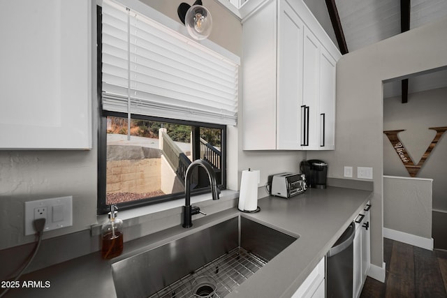 9661 W Coyote Dr, Strawberry, AZ 85544 - kitchen with white cabinetry, dishwasher, a sink, and vaulted ceiling with beams