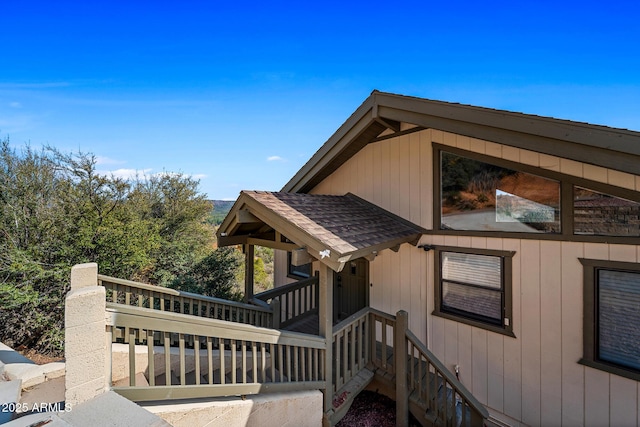 9661 W Coyote Dr, Strawberry, AZ 85544 - view of side of property with a shingled roof and a deck