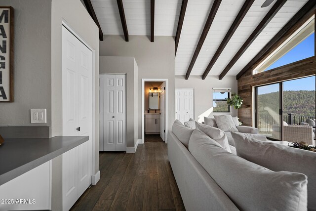 9661 W Coyote Dr, Strawberry, AZ 85544 - living room featuring dark wood-style flooring and lofted ceiling with beams