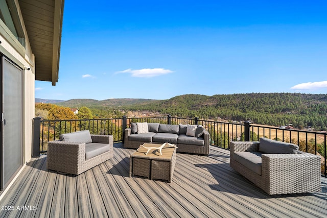 9661 W Coyote Dr, Strawberry, AZ 85544 - wooden deck with an outdoor hangout area, a mountain view, and a view of trees