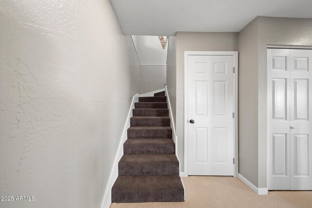 9661 W Coyote Dr, Strawberry, AZ 85544 - stairway with baseboards, carpet floors, and a textured wall