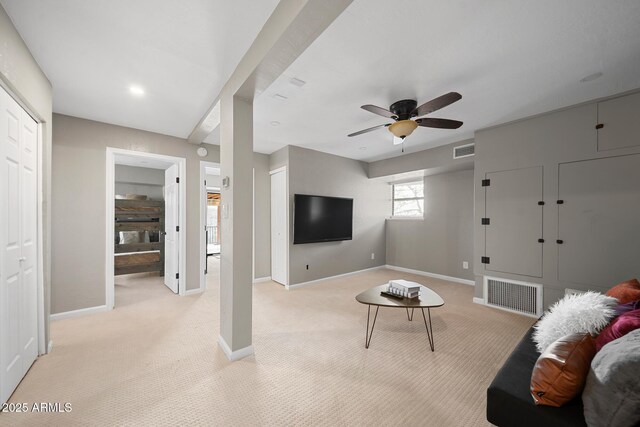 9661 W Coyote Dr, Strawberry, AZ 85544 - living room with light colored carpet, baseboards, ceiling fan, and visible vents