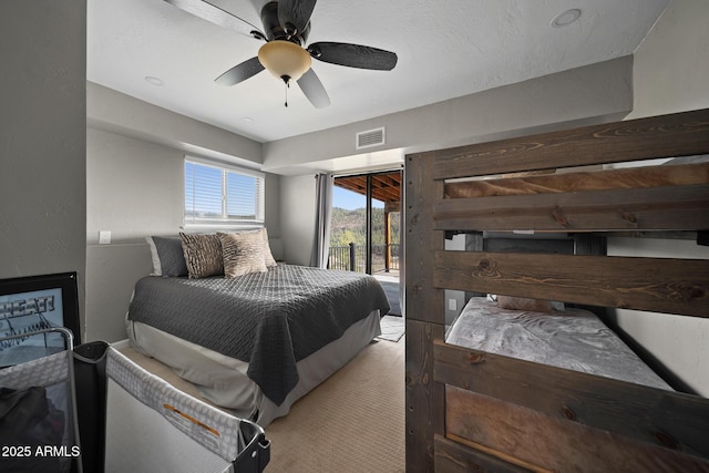 9661 W Coyote Dr, Strawberry, AZ 85544 - bedroom featuring visible vents, ceiling fan, a textured wall, and access to outside