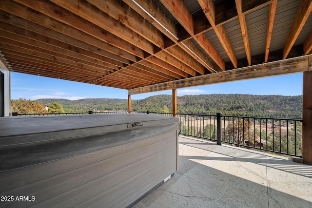 9661 W Coyote Dr, Strawberry, AZ 85544 - view of patio / terrace featuring a wooded view and a hot tub