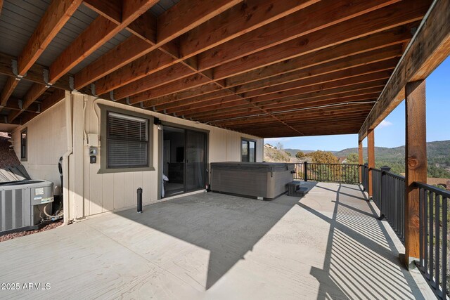 9661 W Coyote Dr, Strawberry, AZ 85544 - view of patio / terrace featuring a hot tub, central AC unit, and a mountain view