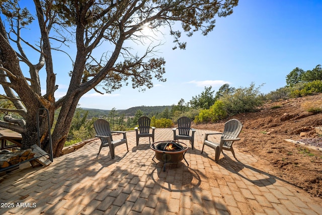 9661 W Coyote Dr, Strawberry, AZ 85544 - view of patio with a fire pit