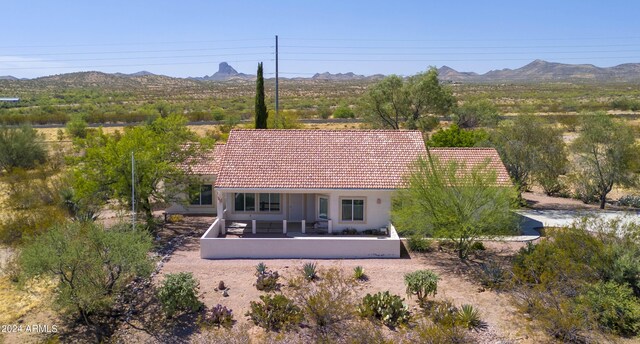 birds eye view of property with a mountain view