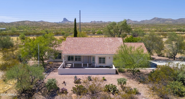 birds eye view of property featuring a mountain view