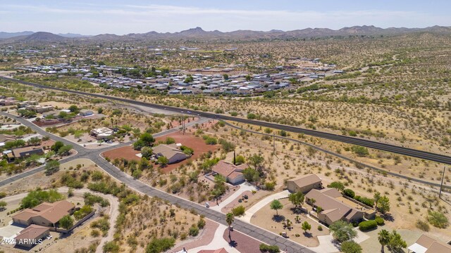 birds eye view of property featuring a mountain view