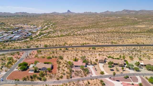 birds eye view of property with a mountain view