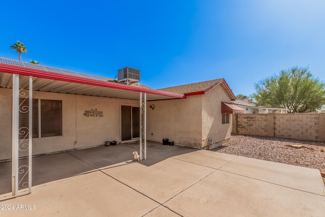 10014 N 66th Ln, Glendale, AZ 85302 - rear view of house featuring a patio, stucco siding, fence, and central AC