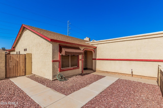 10014 N 66th Ln, Glendale, AZ 85302 - exterior space featuring stucco siding, fence, and a gate