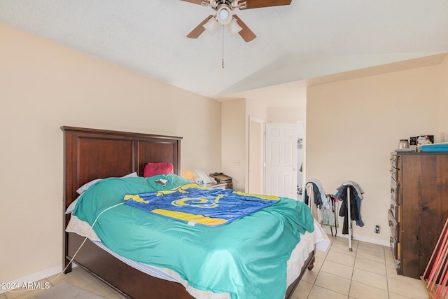 10014 N 66th Ln, Glendale, AZ 85302 - bedroom featuring vaulted ceiling, light tile patterned flooring, baseboards, and a ceiling fan