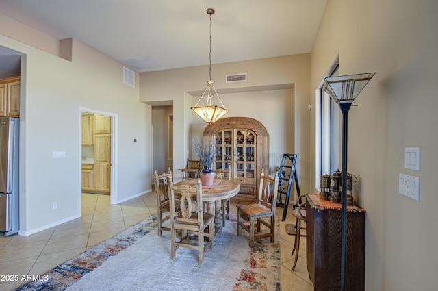 dining space with light tile patterned flooring