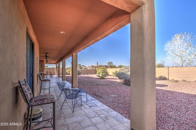 view of patio with ceiling fan