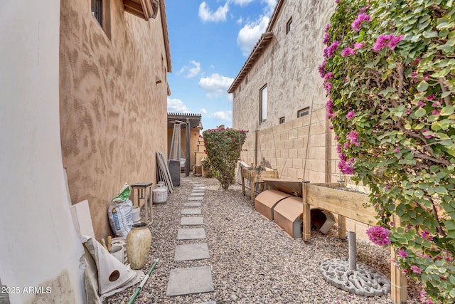 view of yard featuring fence and a pergola