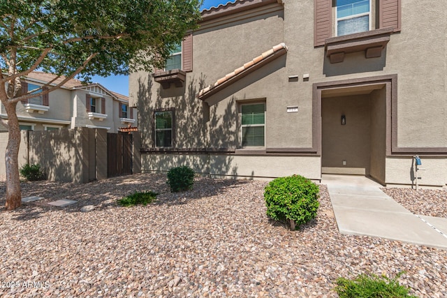 1255 S Rialto Unit 115, Mesa, AZ 85209 - view of exterior entry with stucco siding and a tiled roof