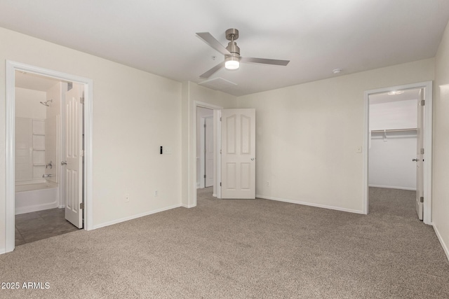 1255 S Rialto Unit 115, Mesa, AZ 85209 - unfurnished bedroom featuring carpet flooring, a spacious closet, a closet, ceiling fan, and ensuite bathroom