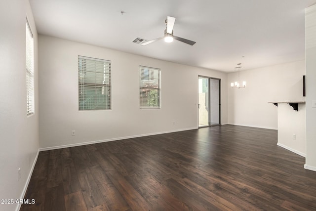 1255 S Rialto Unit 115, Mesa, AZ 85209 - spare room featuring a chandelier, a ceiling fan, and dark wood finished floors
