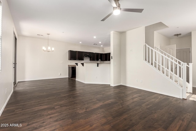 1255 S Rialto Unit 115, Mesa, AZ 85209 - unfurnished living room with a chandelier, dark wood-style floors, a ceiling fan, stairs, and recessed lighting