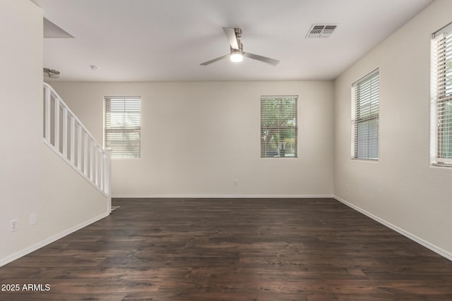 1255 S Rialto Unit 115, Mesa, AZ 85209 - unfurnished room featuring a ceiling fan, stairway, and dark wood finished floors