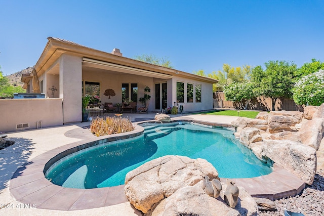 view of swimming pool with a patio