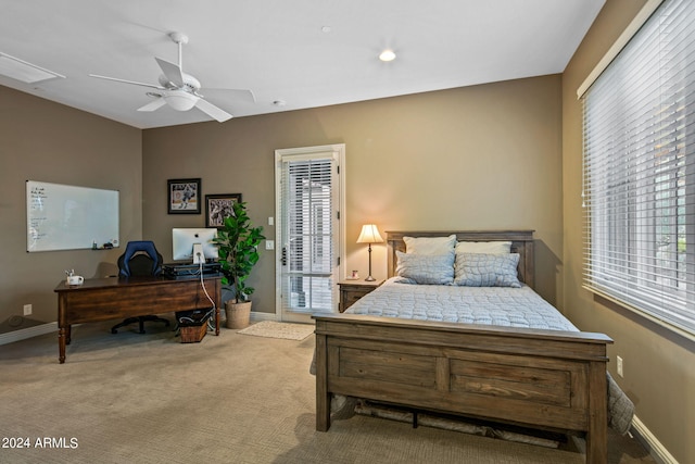 carpeted bedroom featuring access to outside, baseboards, ceiling fan, and visible vents